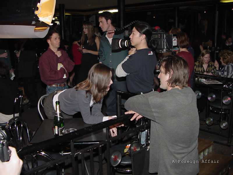 Emily Mortimer talking with David Arquette at foreign affair social